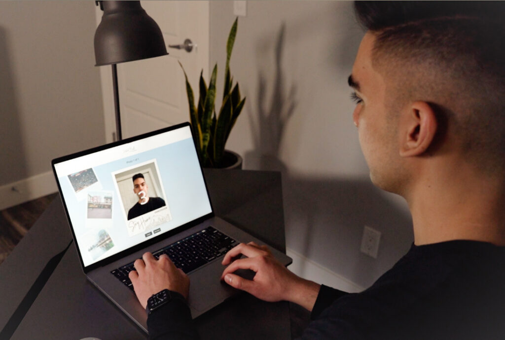 Man using virtual photo booth on laptop